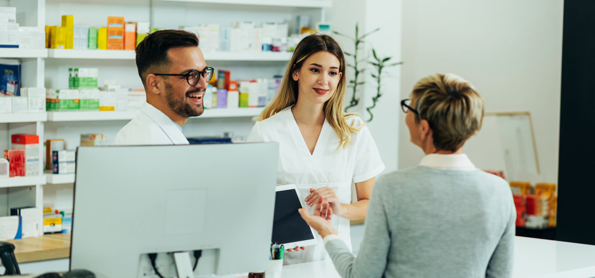 senior woman talking to a pharmacist