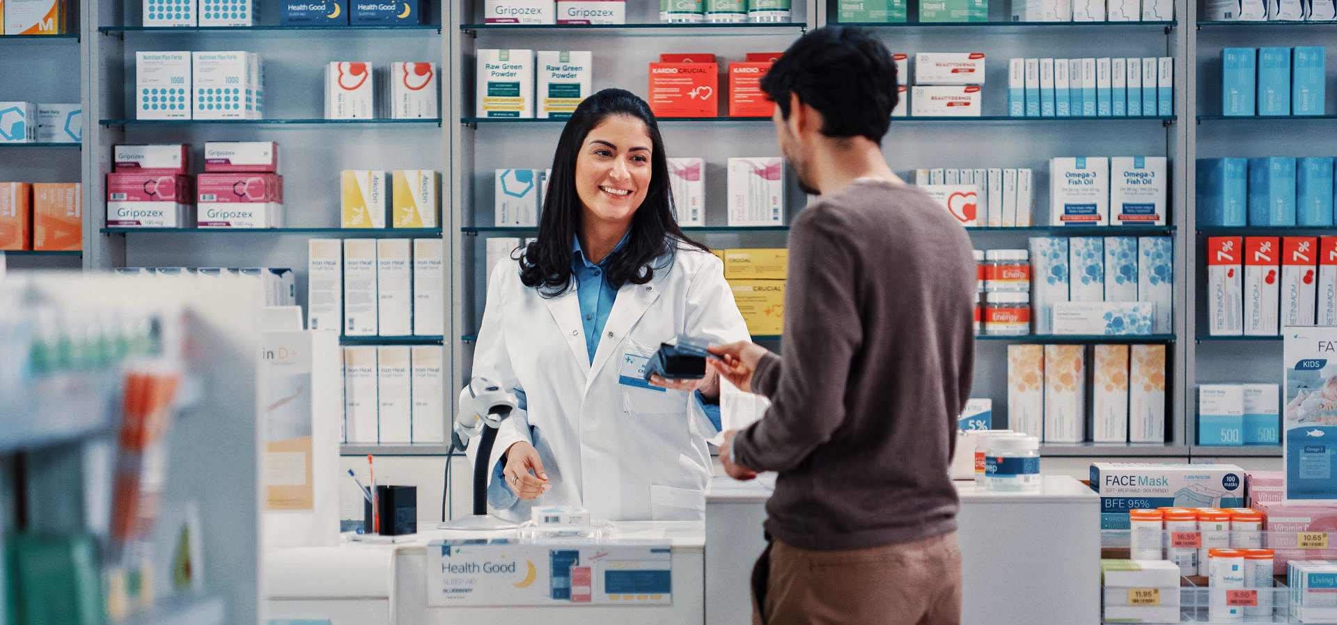 man talking to a pharmacist