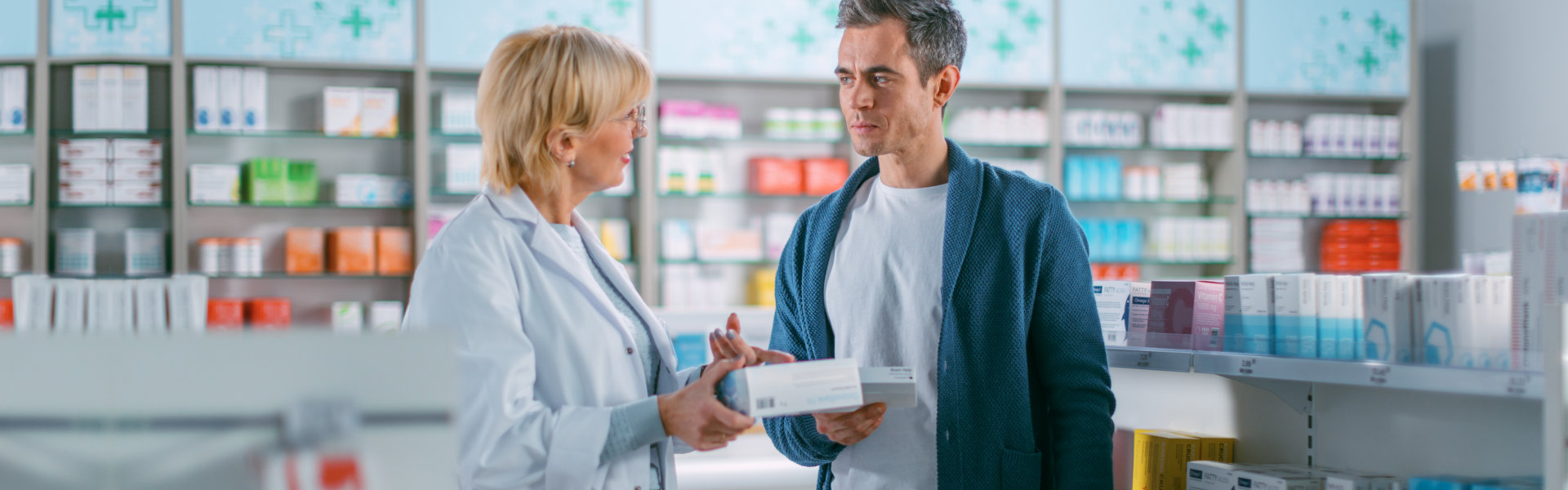 man talking to a pharmacist