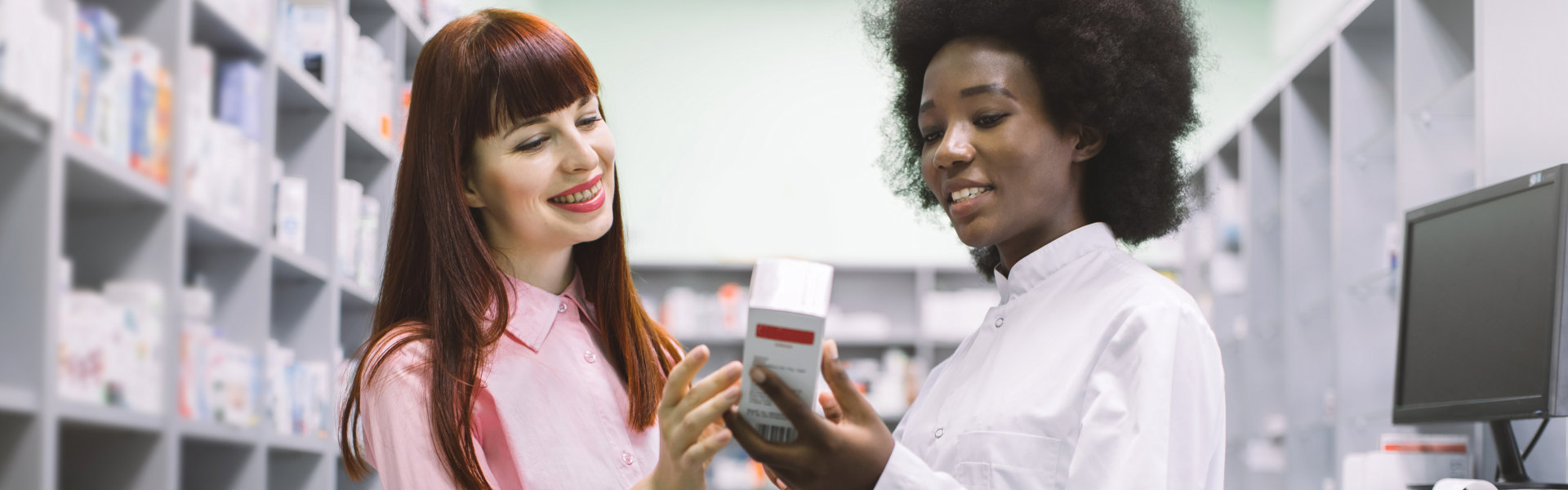 pharmacist talking with her customer